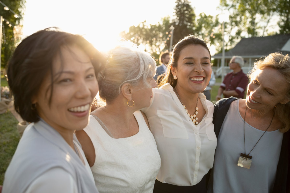 Boy holding up a large globe outdoors